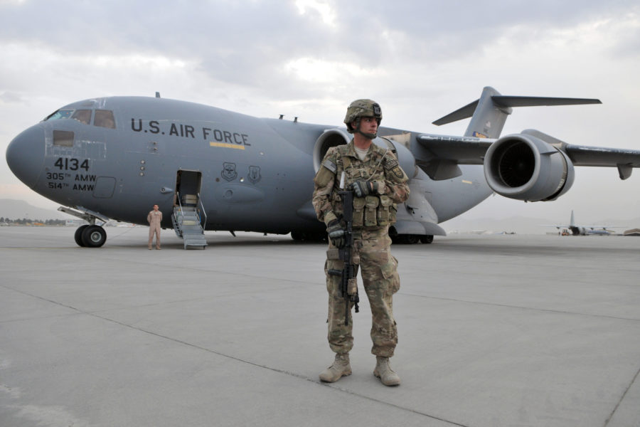 Army Sergeant 1st Class Jon Waterhouse, deployed from the 127th Military Police Company, Fort Carson, Colo., provides security near a C-17 Globemaster from Joint Base McGuire-Dix-Lakehurst while the aircrew wait for Army Gen. Martin E. Dempsey, 18th Chairman of the Joint Chiefs of Staff, to return for the next leg of his trip from Kabul International Airport to another location in the region. During Dempsey's first visit to Regional Command-Capital in Kabul, Oct. 20, 2011, he met with Marine Gen. John R. Allen, commander of NATOÕs International Security Assistance Force in Afghanistan (ISAF), and U.S. Army Lt. Gen. Curtis Scaparrotti, ISAF Joint Command commander. Waterhouse is the personal security officer to COMISAF and is a native of Yucaipa, Calif. (U.S. Air Force photo/Master Sgt. Michael OÕConnor/Released)