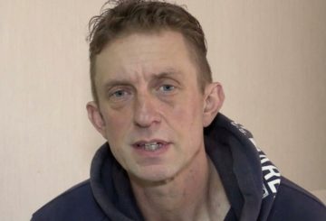 A still image taken from Russian state TV footage that it said shows Shaun Pinner, a British fighter captured in the Ukrainian city of Mariupol by Russian forces, at an unknown location, in a still image from a video released on April 18, 2022. RURTR/RUSSIAN STATE TV CHANNEL ROSSYIA 1/Handout via REUTERS TV ATTENTION EDITORS - THIS IMAGE WAS PROVIDED BY A THIRD PARTY. NO RESALES. NO ARCHIVES. MANDATORY CREDIT. RUSSIA OUT. NO COMMERCIAL OR EDITORIAL SALES IN RUSSIA.